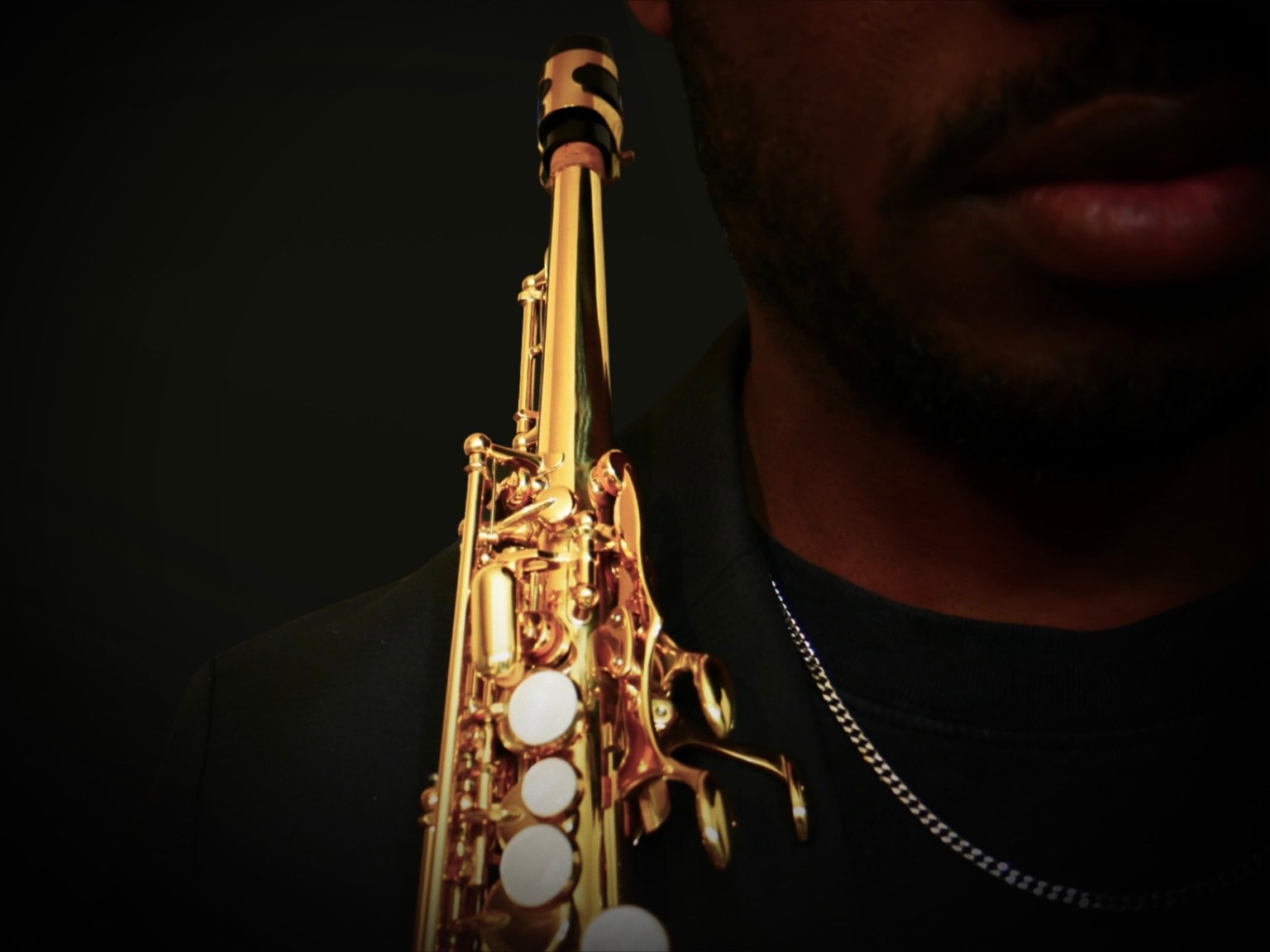 Close-up of TAVE and his saxophone
